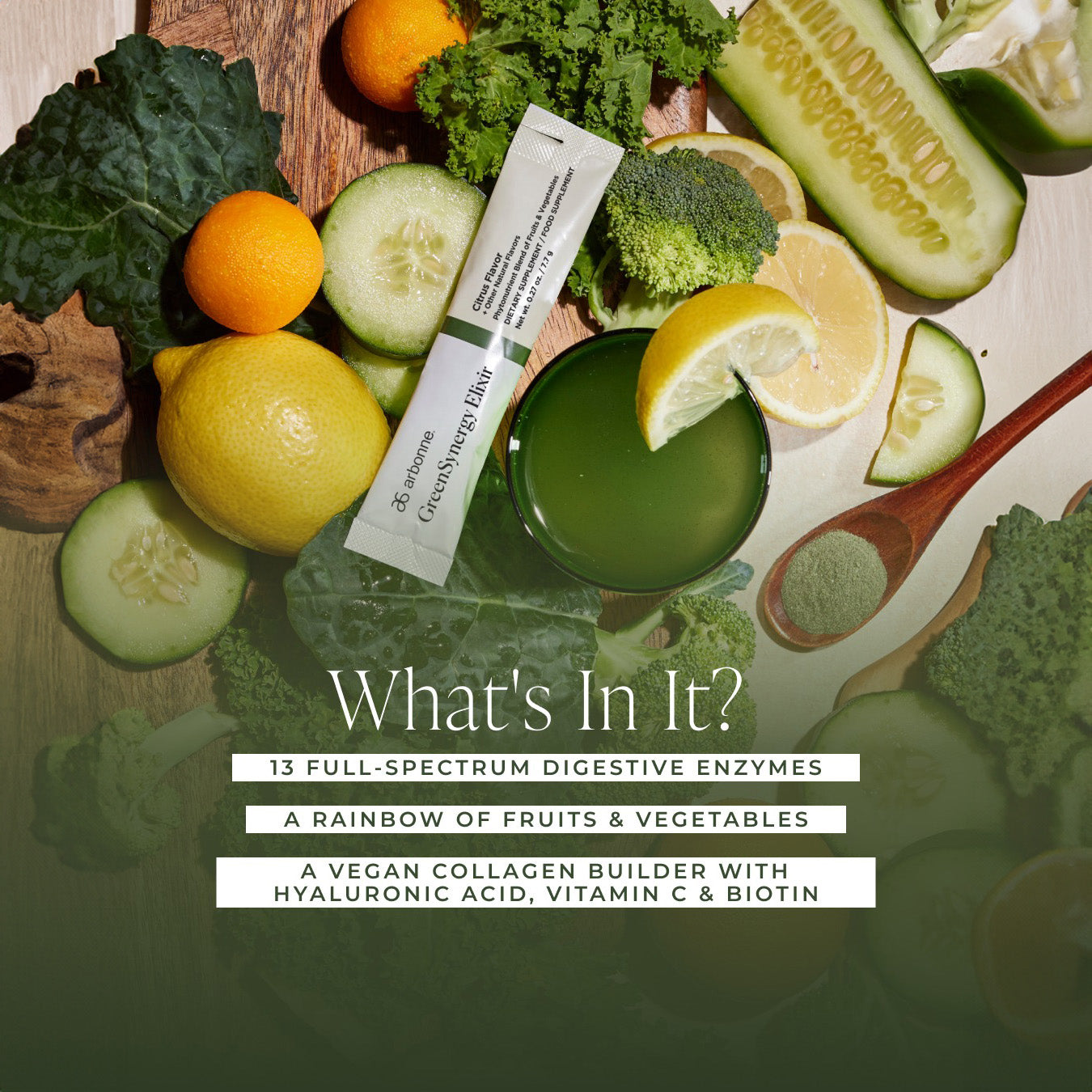 Arbonne GreenSynergy Elixir packet with a green drink surrounded by fresh fruits and vegetables, including cucumbers, kale, broccoli, and lemons, with text highlighting the ingredients: digestive enzymes, fruits and vegetables, and vegan collagen builder with hyaluronic acid, vitamin C, and biotin.